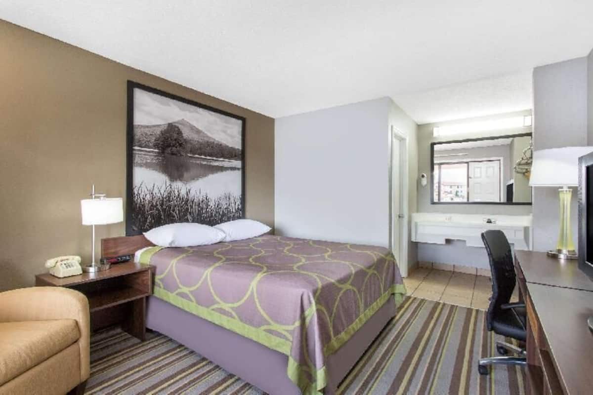 Desk, laptop workspace, blackout curtains, iron/ironing board