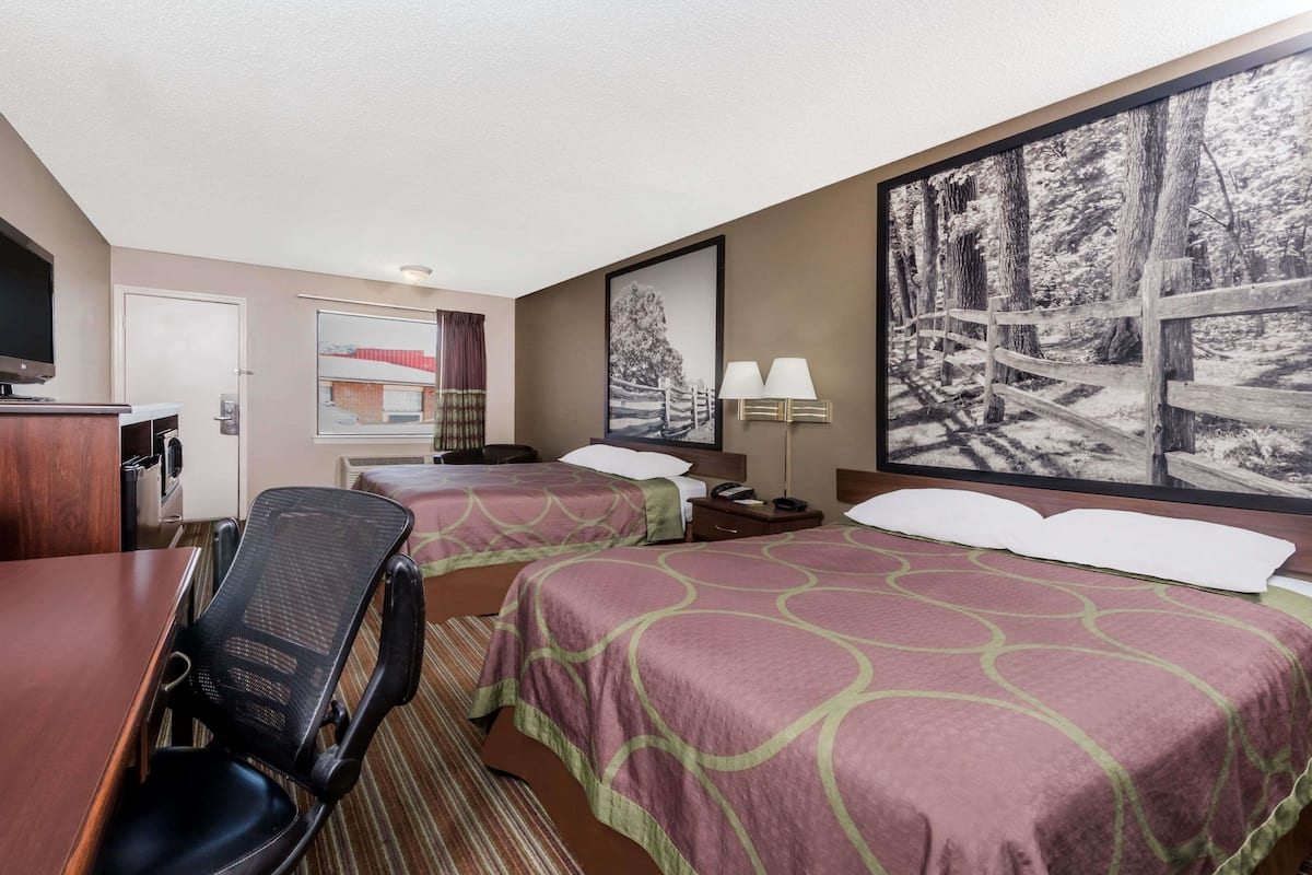 Desk, laptop workspace, blackout drapes, iron/ironing board