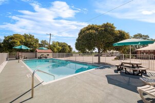 Outdoor pool, open 10 AM to 10 PM, pool umbrellas, sun loungers