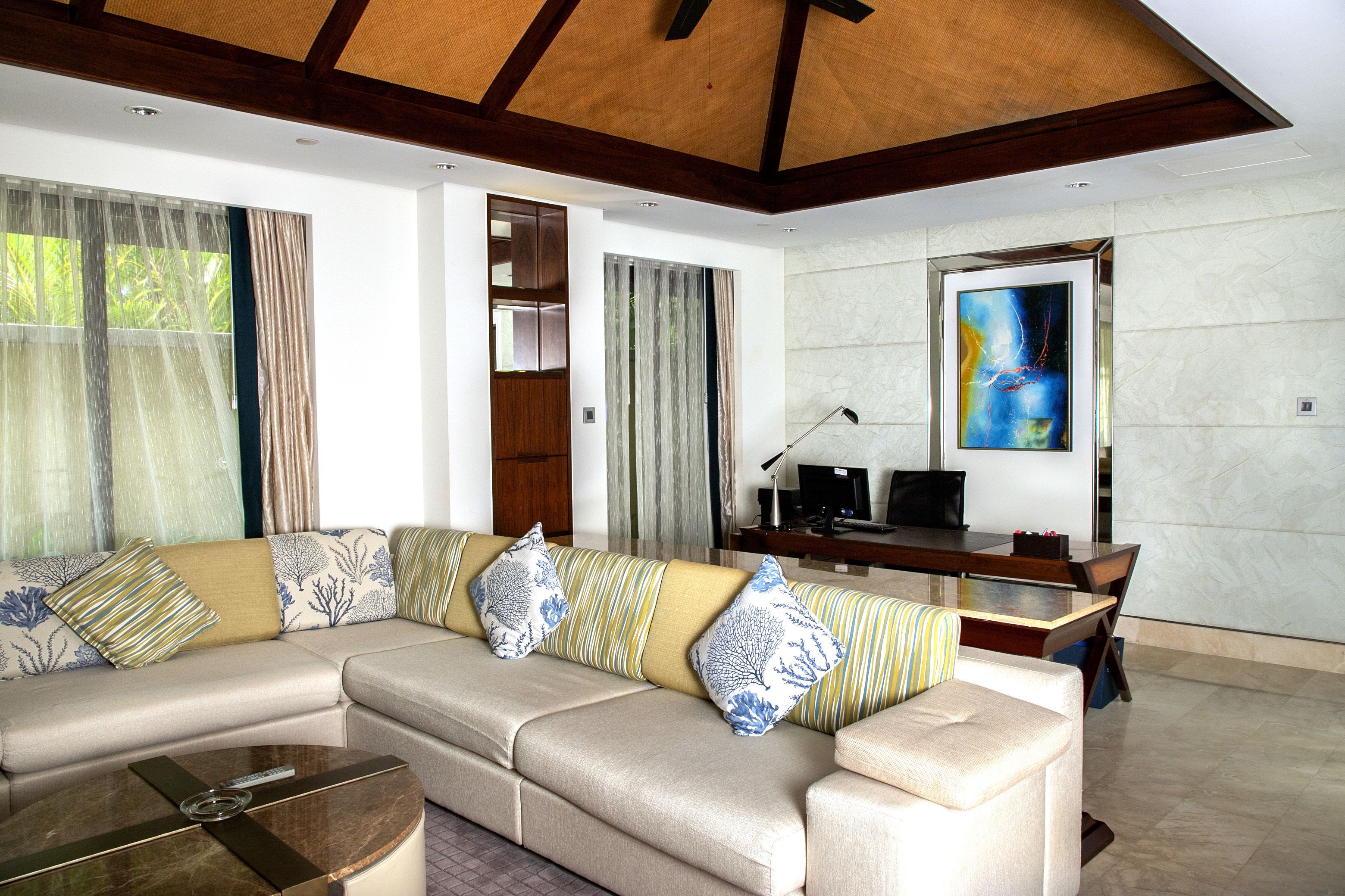 deluxe ocean front villa | living area | 48-inch lcd tv with premium tv channels, tv, dvd player
