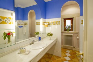 Shower, hair dryer, slippers, towels