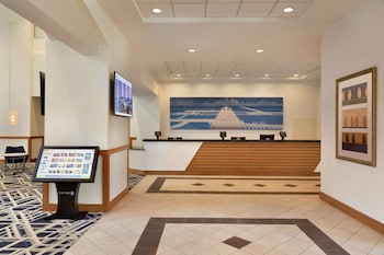 Hotel entrance and lobby at Embassy Suites Boston Logan Airport