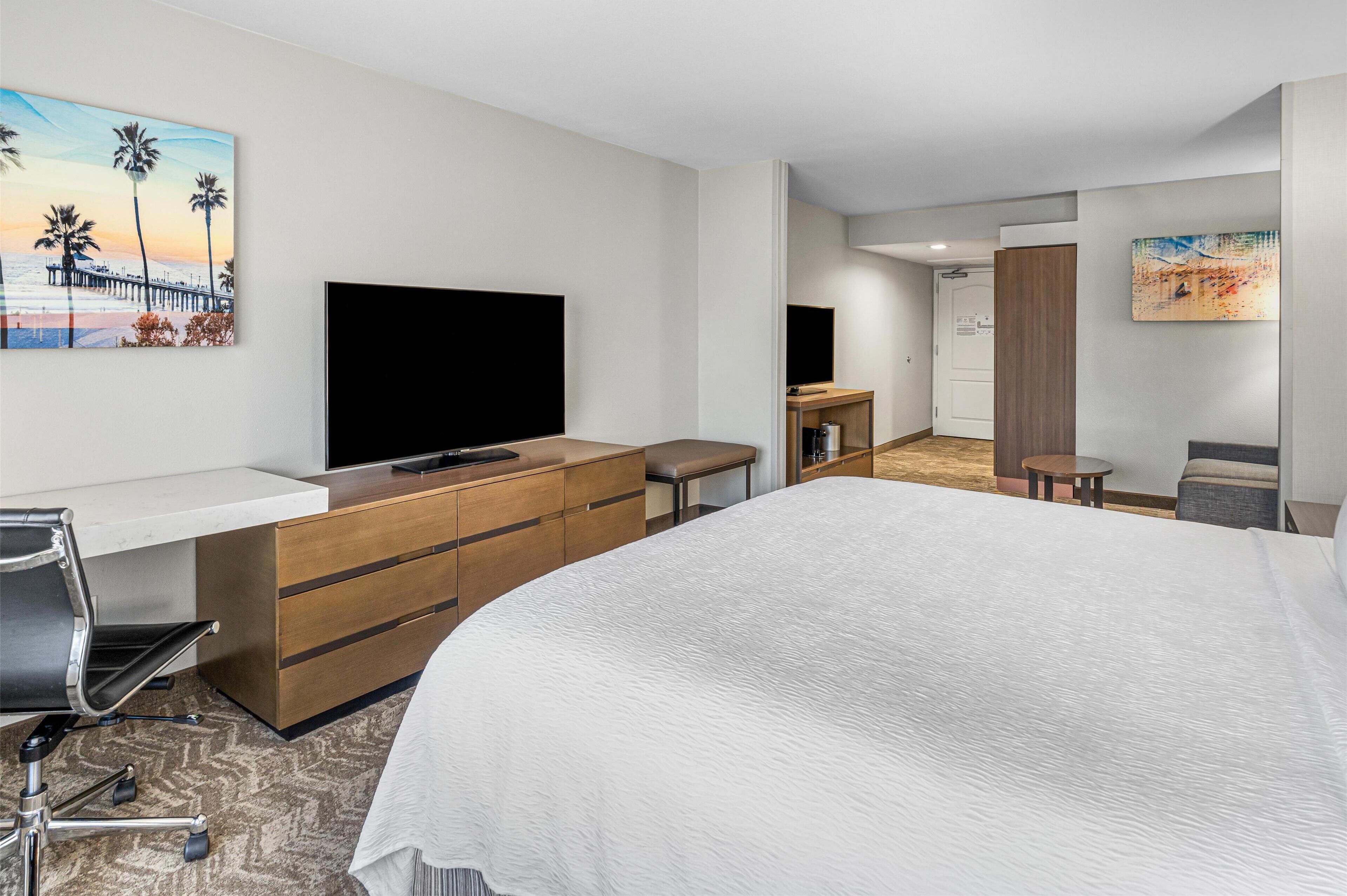 suite, 1 king bed, non smoking, refrigerator & microwave (with sofabed) | 1 bedroom, desk, laptop workspace, iron/ironing board