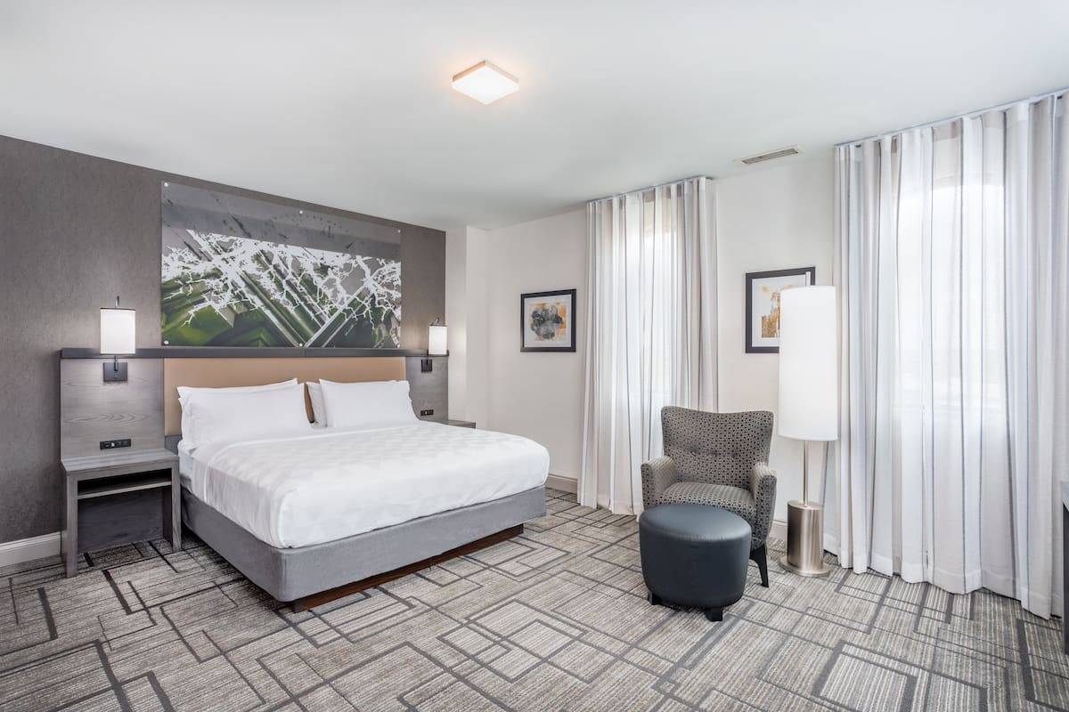 Suite, 1 King Bed, Jetted Tub | 1 bedroom, desk, laptop workspace, blackout drapes
