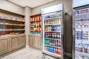 A vending area with snacks, drinks, and packaged food items. - Holiday Inn Lafayette-City Centre by IHG (Lafayette)