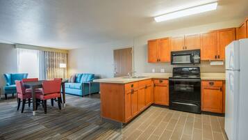 Suite, 1 King Bed, Kitchen | Private kitchen | Microwave, coffee/tea maker