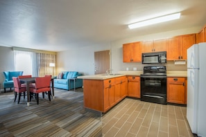 Suite, 1 King Bed, Kitchen | Private kitchen | Microwave, coffee/tea maker