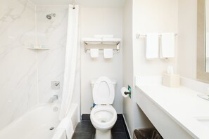 Combined shower/tub, hair dryer, towels, soap