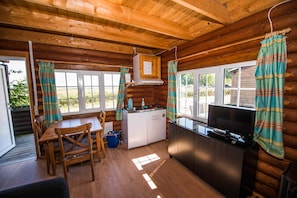 Round Timber Cabins | Living area | TV