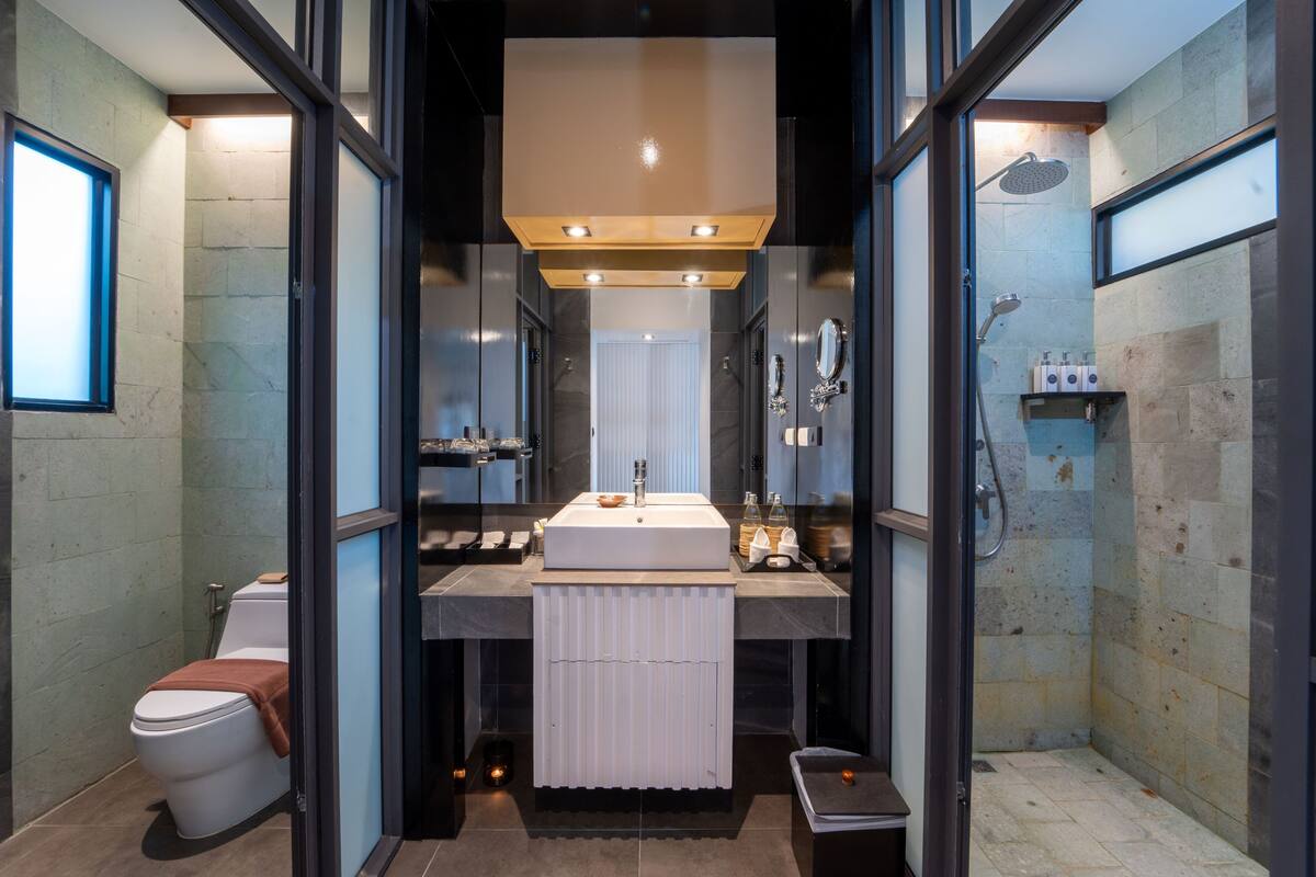 beachfront pool villa | bathroom | eco-friendly toiletries, hair dryer, bathrobes, slippers