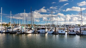 A marina with numerous boats docked at the pier. - Kemah Boardwalk Inn (Kemah)
