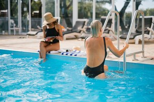 Indoor pool, a heated pool, open 7:00 AM to 8:00 PM, pool loungers