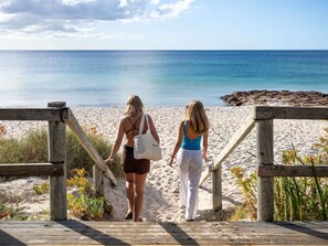 A wooden boardwalk leading to a beach with clear skies. - Bayview Geographe Resort by Accor (Broadwater)