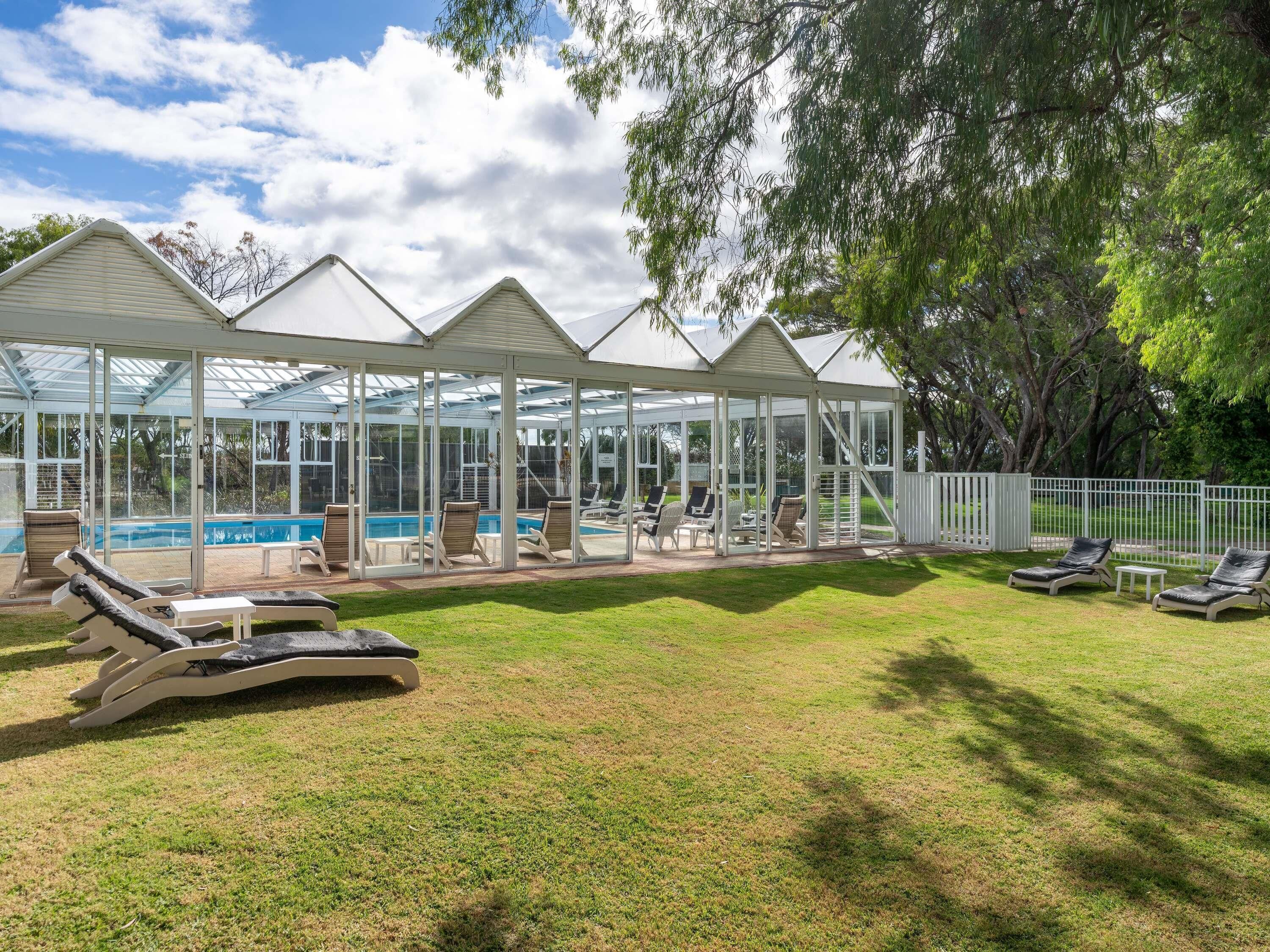Indoor pool, a heated pool, open 7:00 AM to 7:00 PM, pool loungers