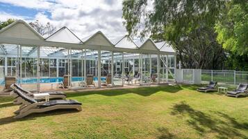 Indoor pool, a heated pool, open 7:00 AM to 7:00 PM, pool loungers
