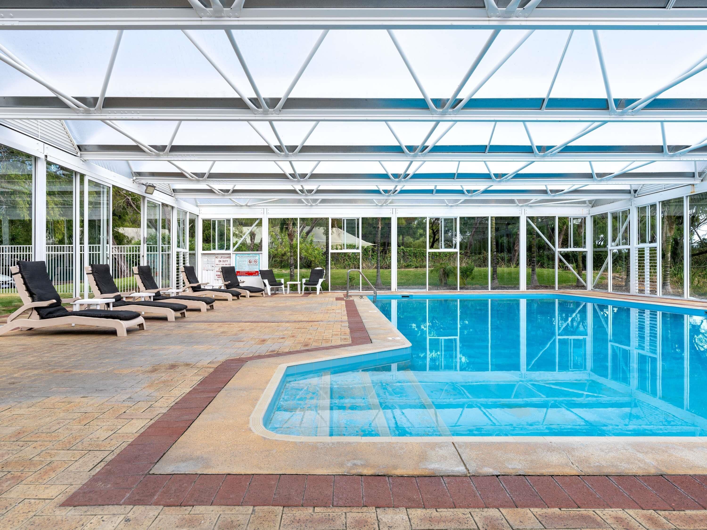Indoor pool, a heated pool, open 7:00 AM to 8:00 PM, sun loungers