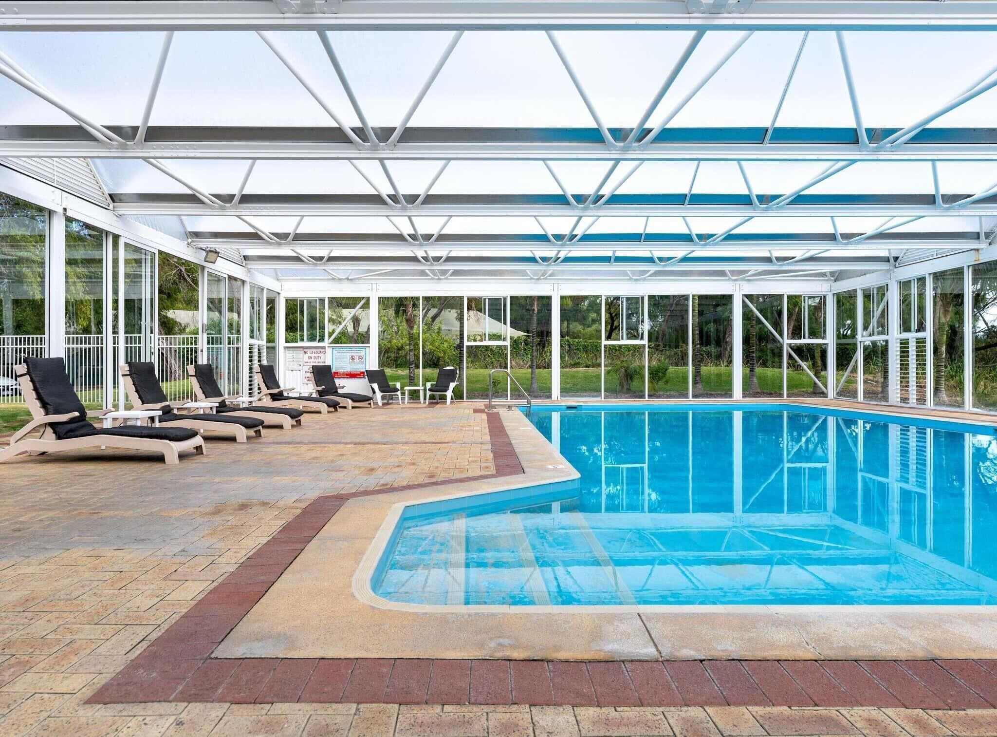 Indoor pool, a heated pool, open 7:00 AM to 7:00 PM, sun loungers