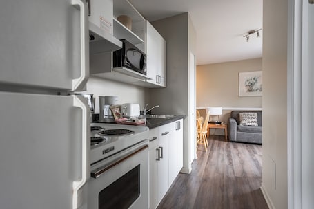 Suite, 1 Queen Bed with Sofa bed | Private kitchen | Fridge, microwave, coffee/tea maker