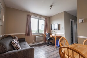 Suite, 1 Queen Bed with Sofa bed | Living area | LCD TV
