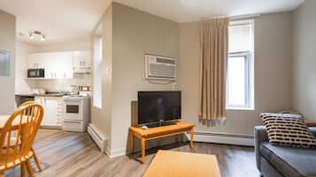 Suite, 1 Queen Bed with Sofa bed | Living area | LCD TV