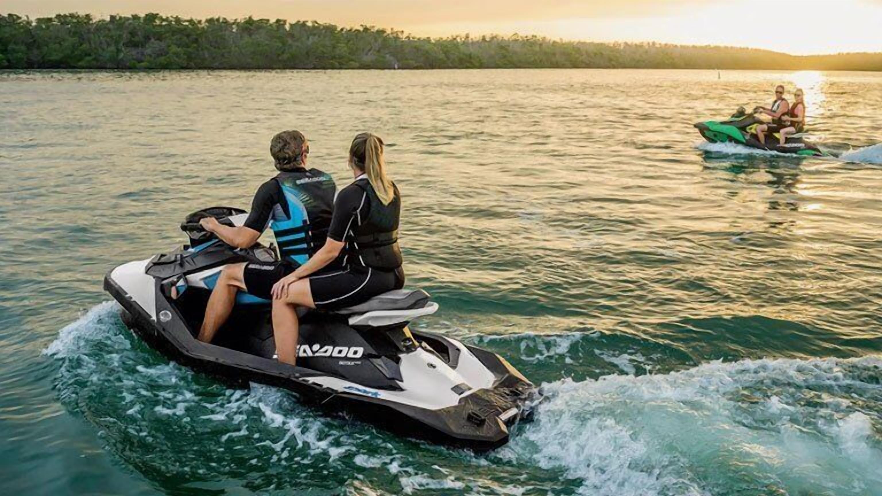 A person riding a jet ski on a body of water.
