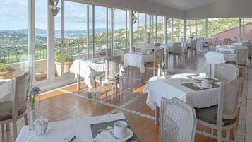 Breakfast, dinner served; Mediterranean cuisine, golf course views