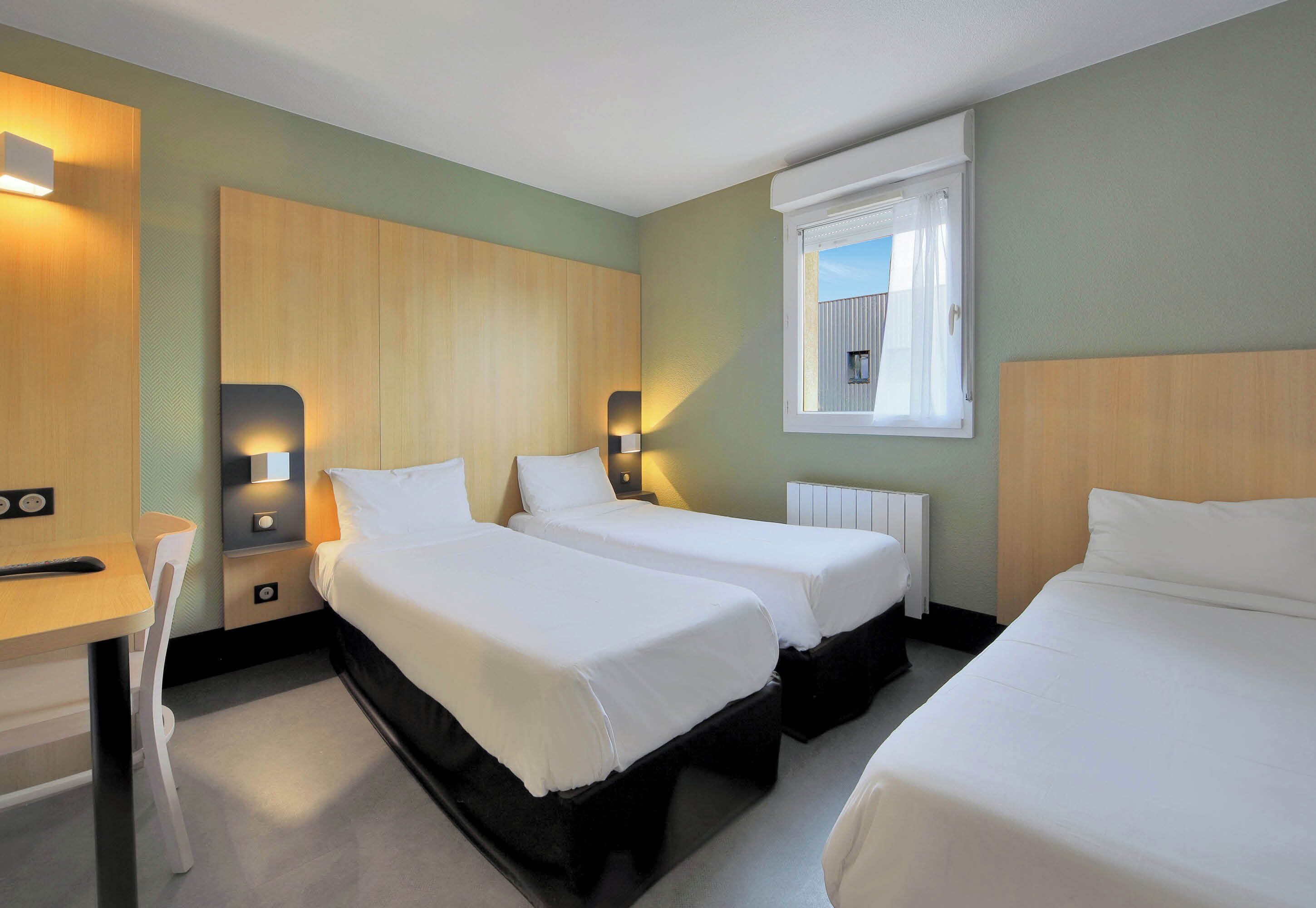 Triple Room, Non Smoking | Desk, iron/ironing board, free WiFi, bed sheets