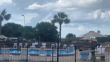 Outdoor pool, open 9:00 AM to 10:00 PM, pool loungers