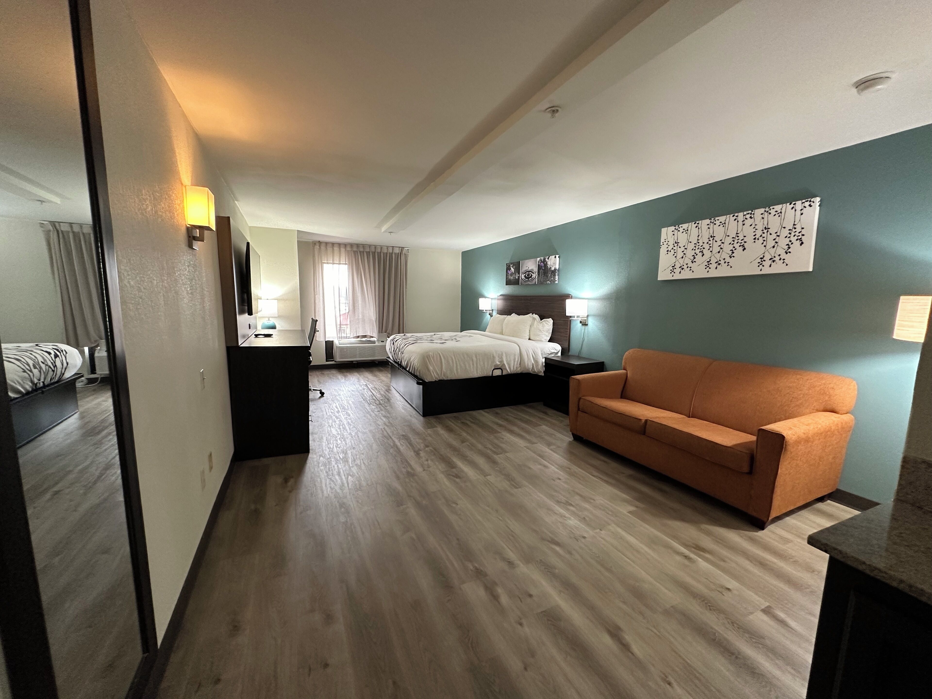 Premium bedding, desk, laptop workspace, blackout drapes