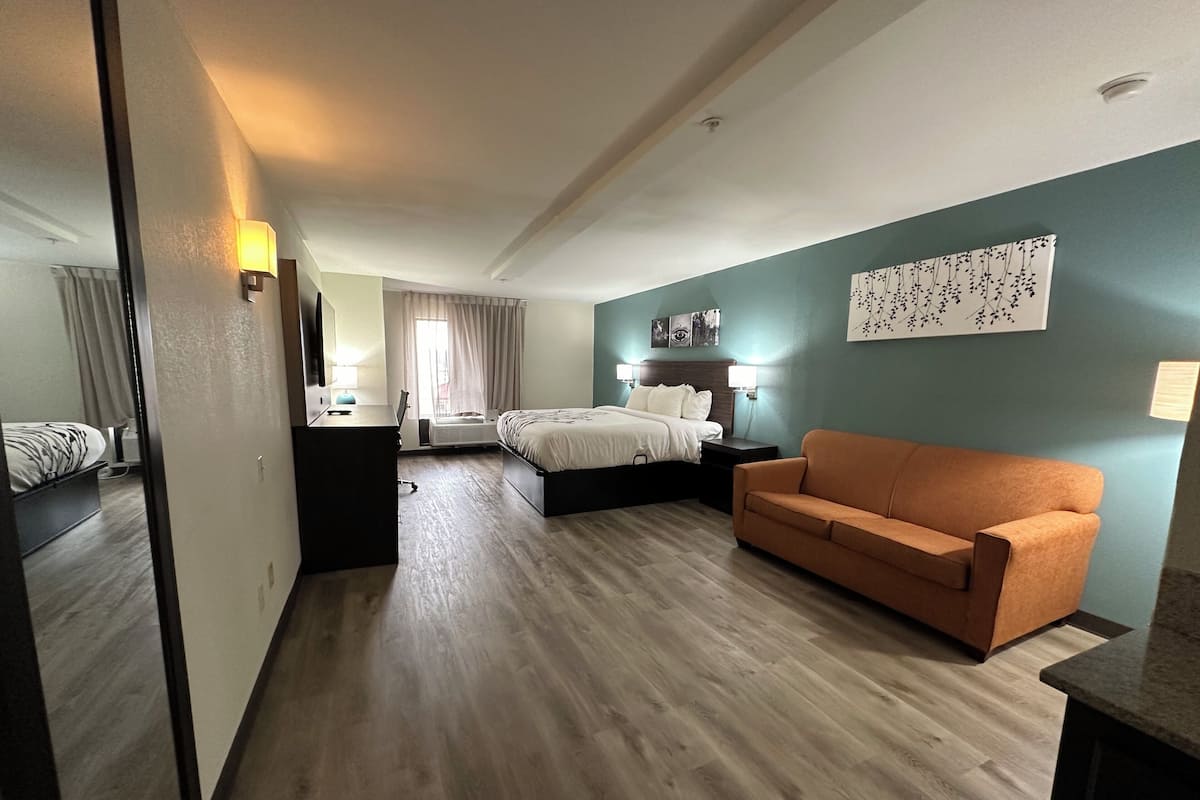 Premium bedding, desk, laptop workspace, blackout drapes