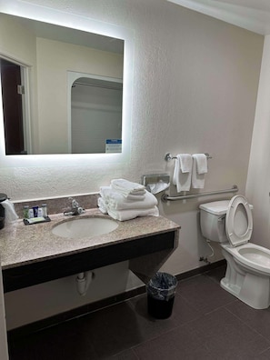 Premium bedding, desk, laptop workspace, blackout drapes