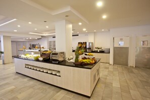 A modern kitchen with a central island, equipped with a coffee machine, and surrounded by various appliances and utensils. - FERGUS Style Bahamas (Sant Josep de sa Talaia)