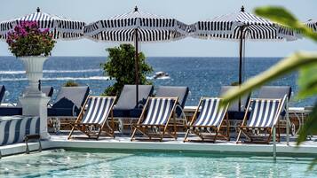 Outdoor pool, pool umbrellas, sun loungers