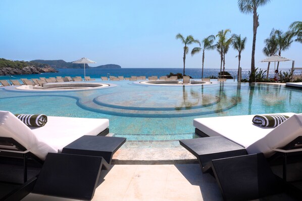 2 outdoor pools, pool umbrellas, pool loungers