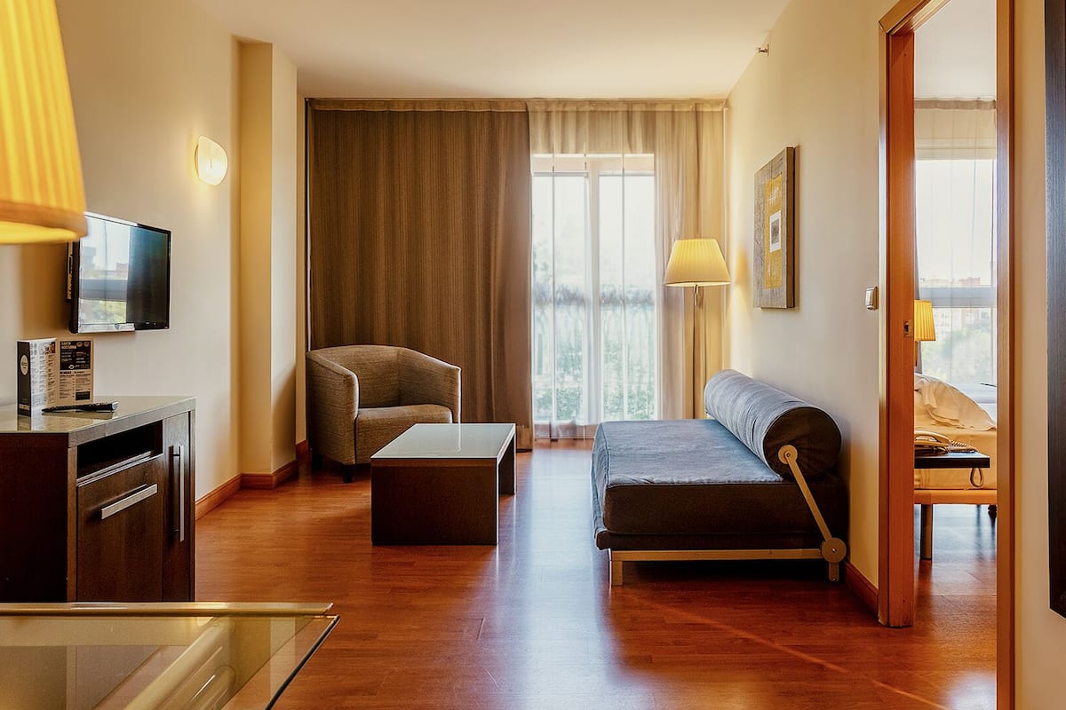 Junior Suite | Minibar, in-room safe, desk, iron/ironing board