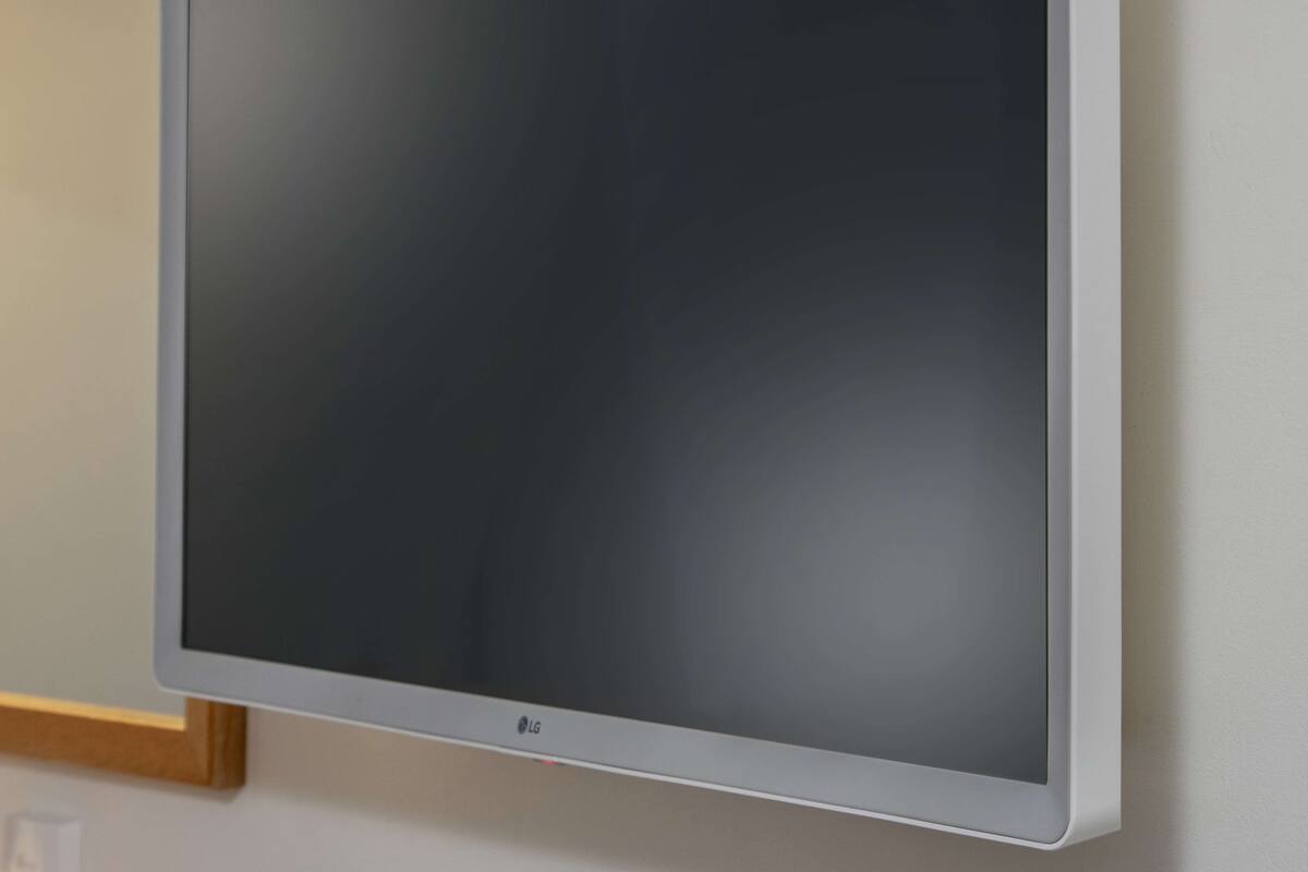 A flat-screen TV mounted on a wall.