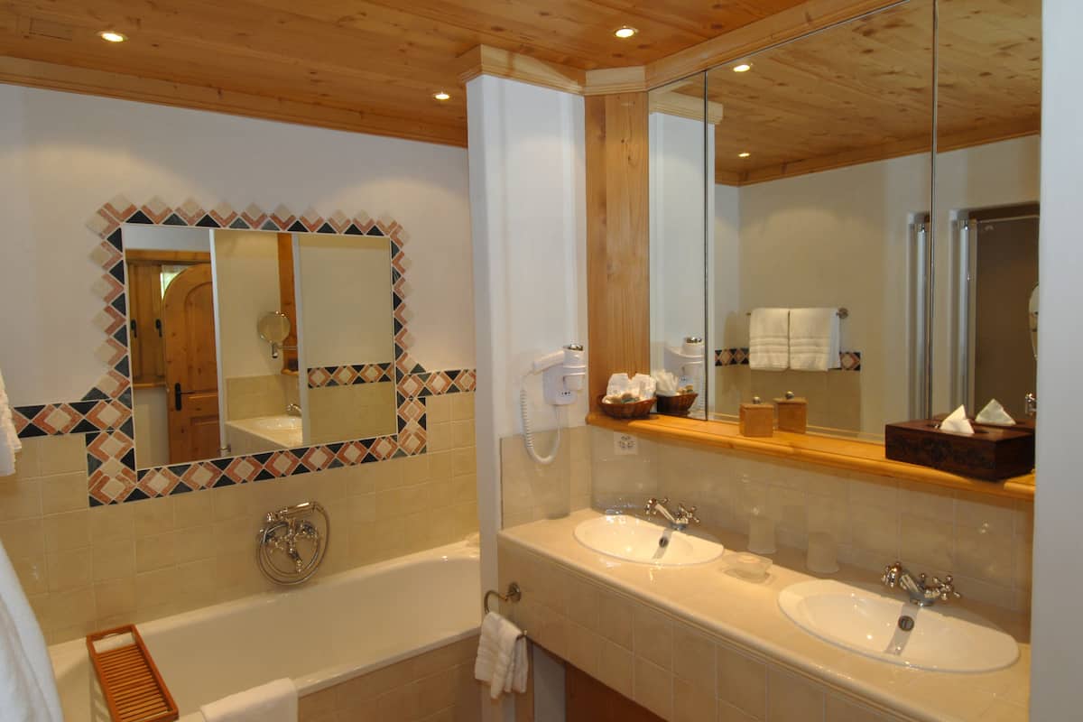suite, balcony, mountain view (south view) | bathroom | separate bathtub and shower, designer toiletries, hair dryer, bathrobes