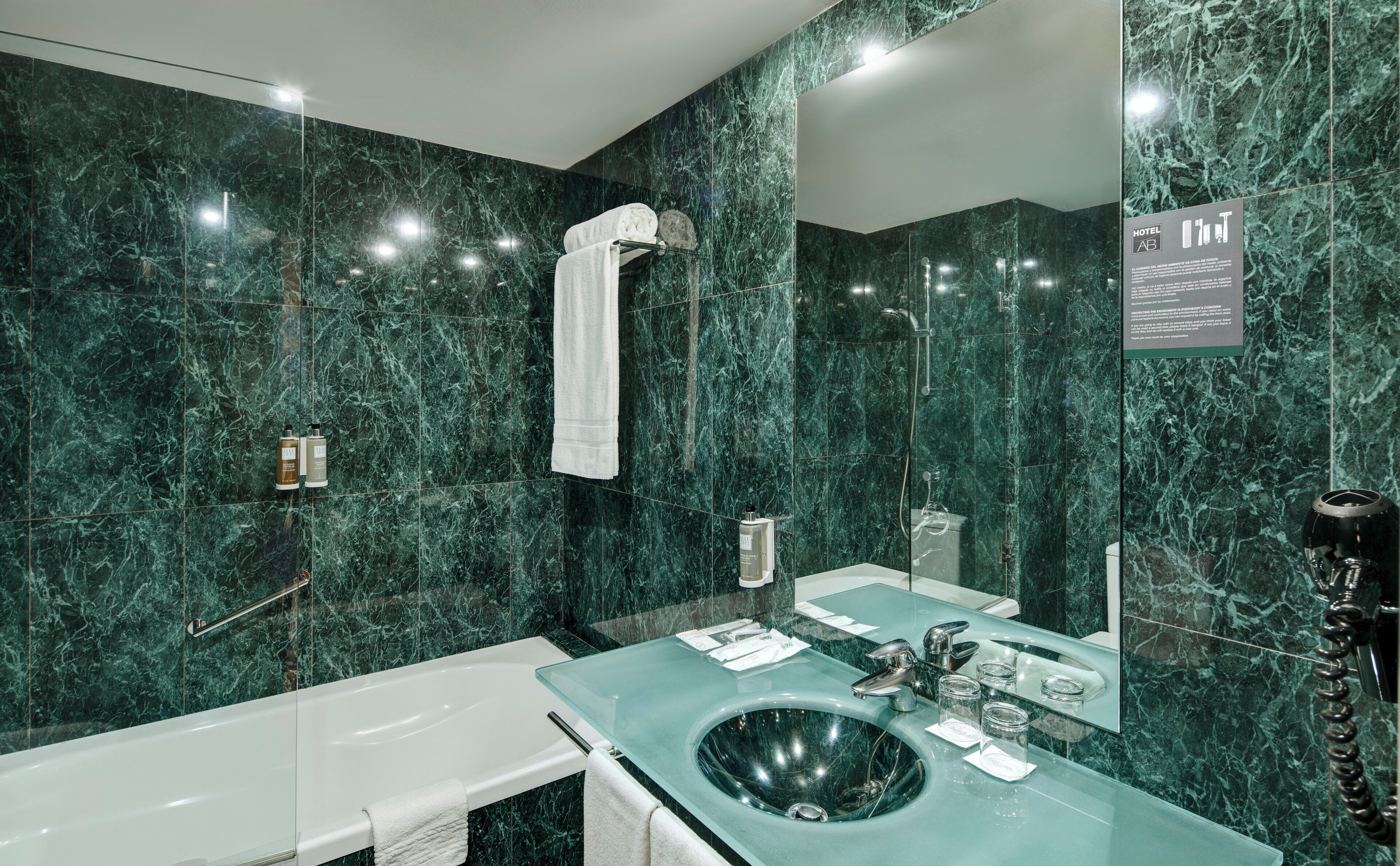 designer toiletries, hair dryer, bidet, towels