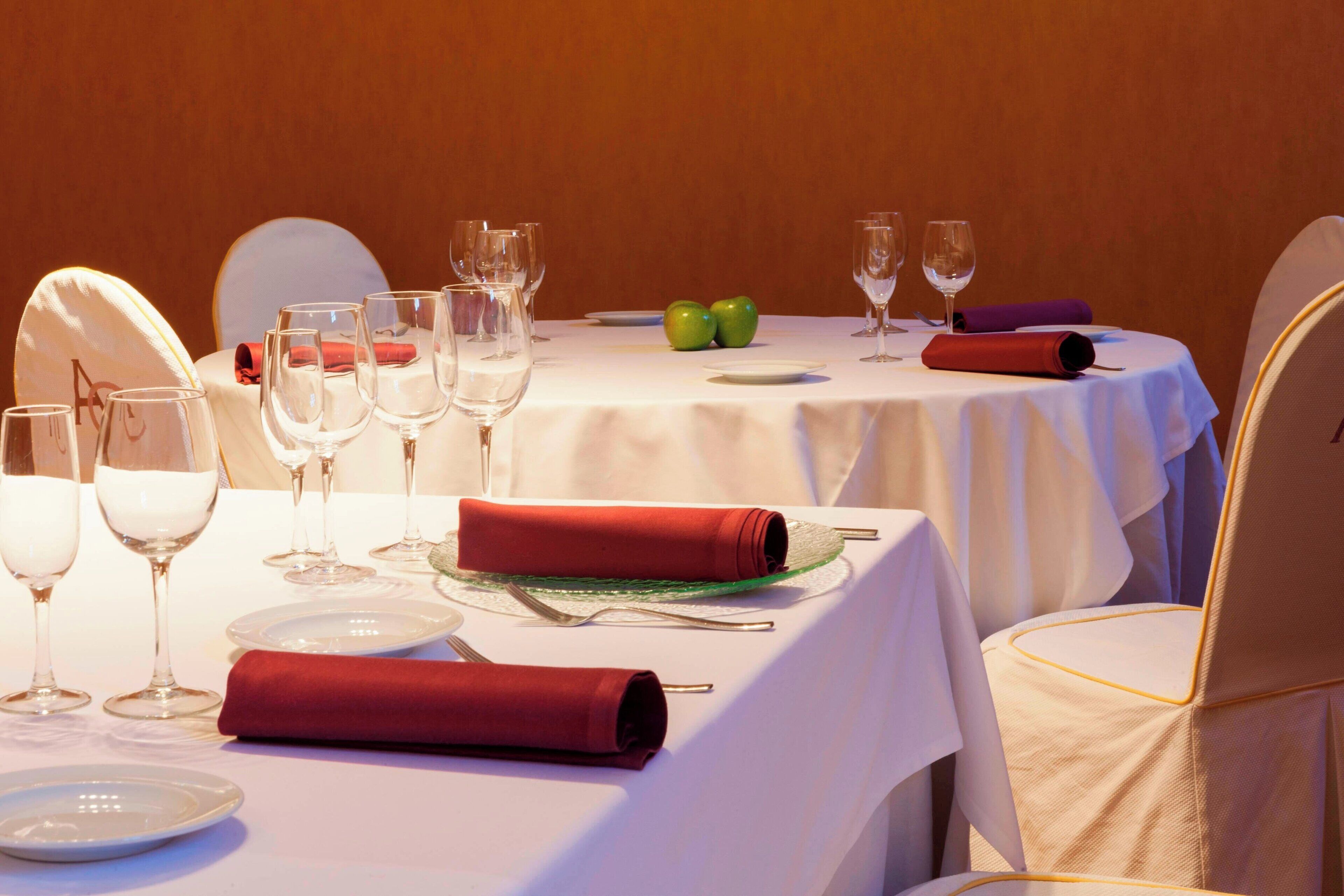 A table set for a meal with plates, glasses, and cutlery.