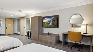 A hotel room with two beds, a desk with a chair, a wardrobe, and a TV mounted on the wall. - Holiday Inn Express Hotel & Suites Vacaville by IHG (Vacaville)