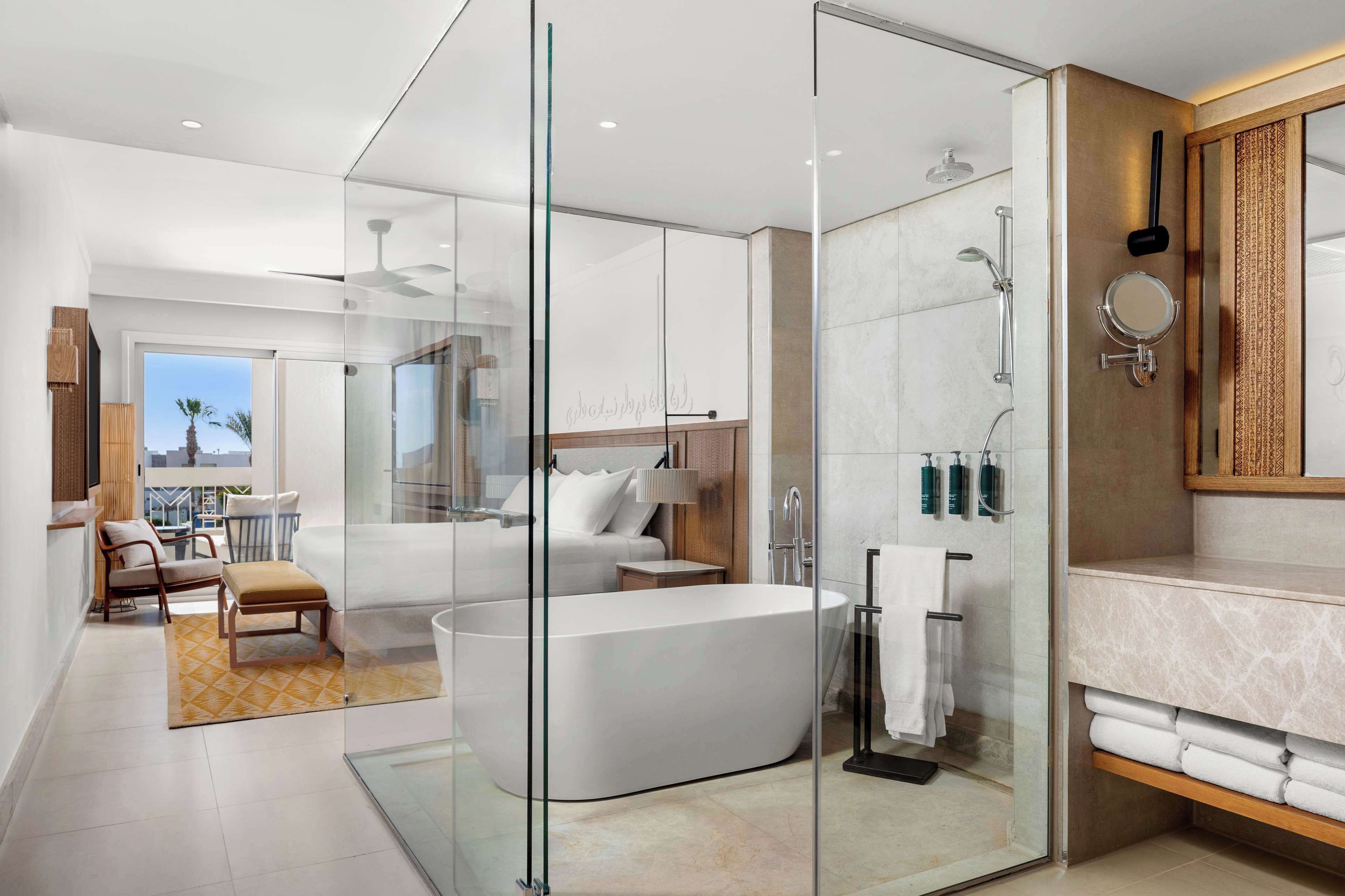 romantic suite, king bed, sea view, beachside | bathroom | spring water bathtub, free toiletries, hair dryer, slippers