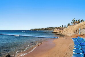 Private beach, free beach shuttle, sun loungers, beach umbrellas