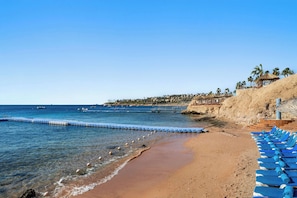 Private beach, free beach shuttle, sun-loungers, beach umbrellas