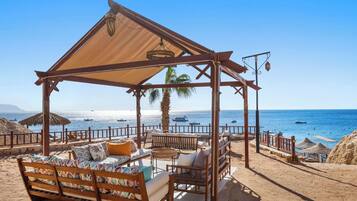 Private beach, free beach shuttle, sun loungers, beach umbrellas