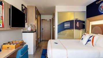 Relax in this stylish room with a large bed, flat-screen TV, and kitchenette, plus a foosball table for entertainment.