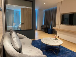 Junior Suite, 1 Bedroom | Living area | 32-inch LED TV with satellite channels, TV