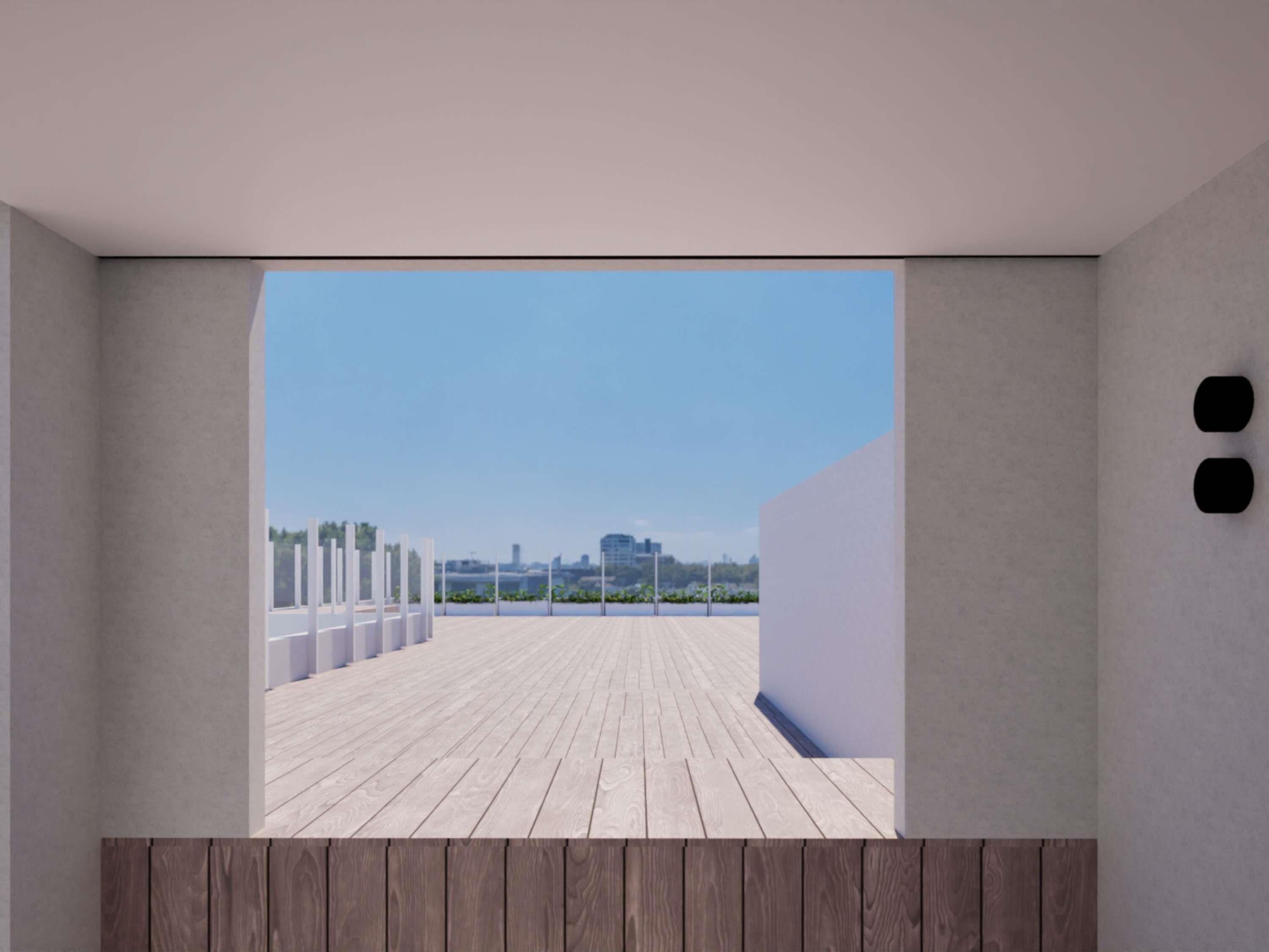 A modern interior with a view of a wooden deck and a clear sky.