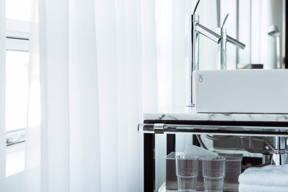 designer toiletries, hair dryer, bathrobes, slippers