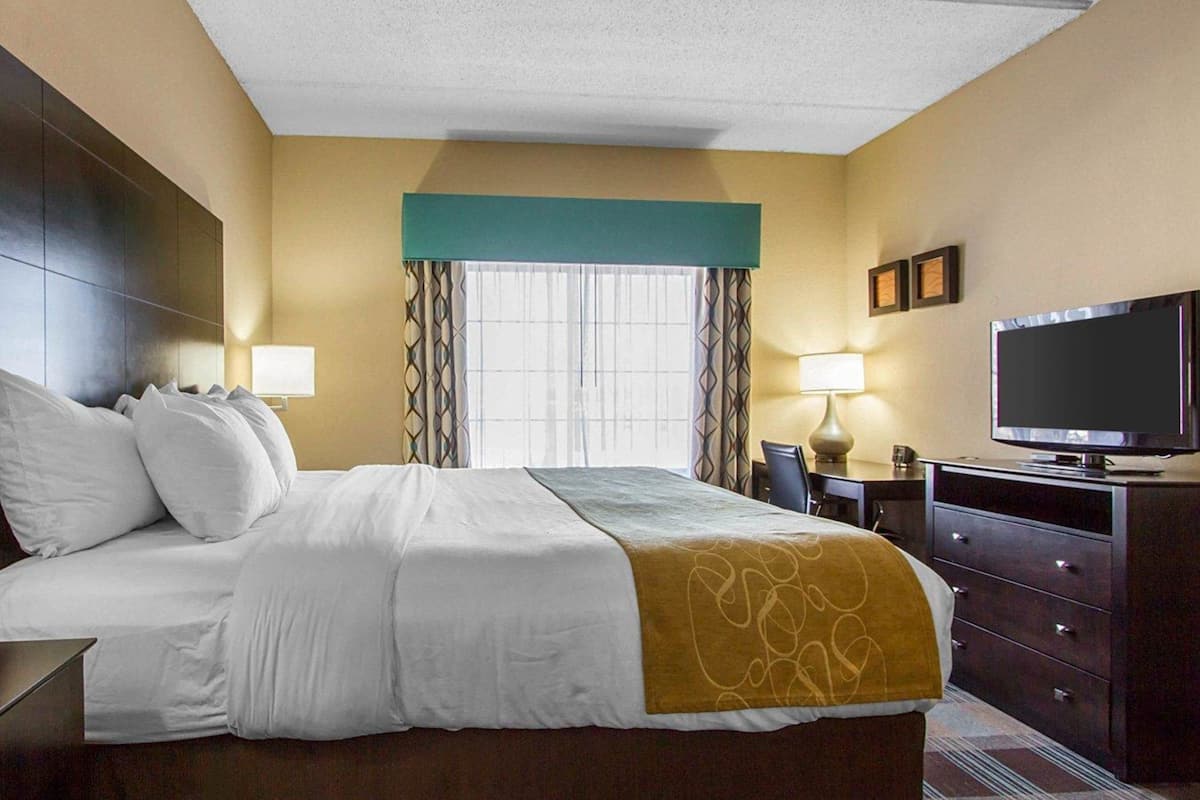 desk, blackout curtains, iron/ironing board, free rollaway beds