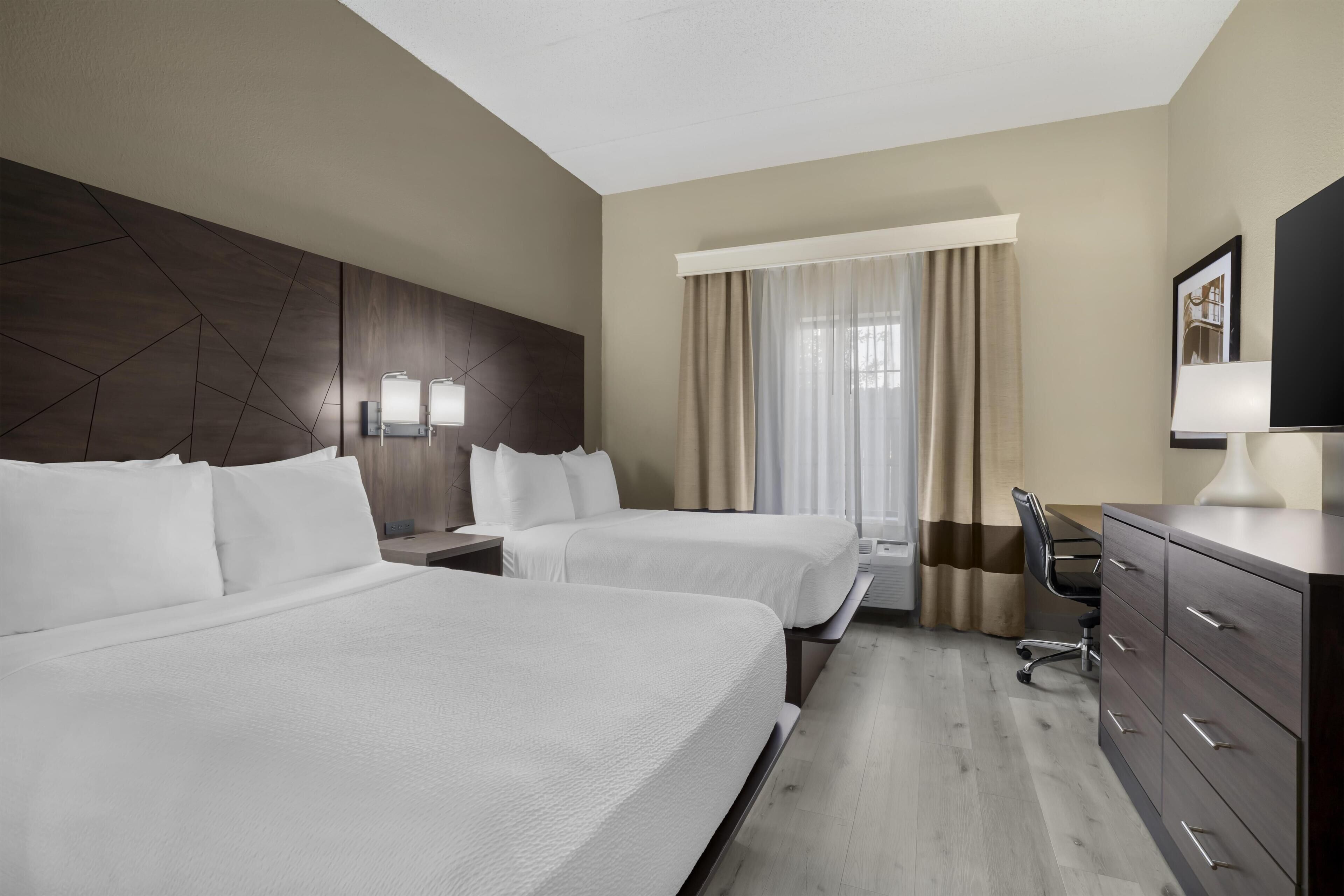 Desk, blackout curtains, iron/ironing board, free rollaway beds